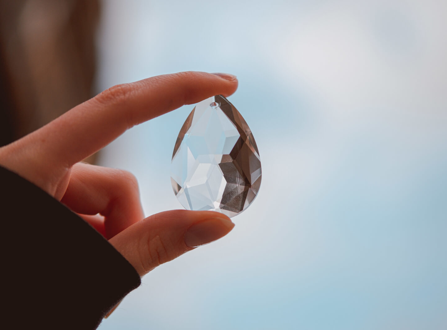Woman holding clear crystal