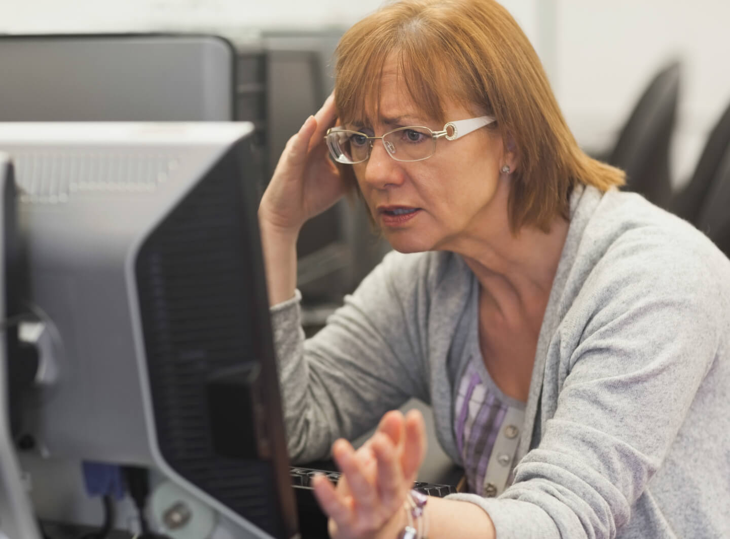 Woman confused by computer
